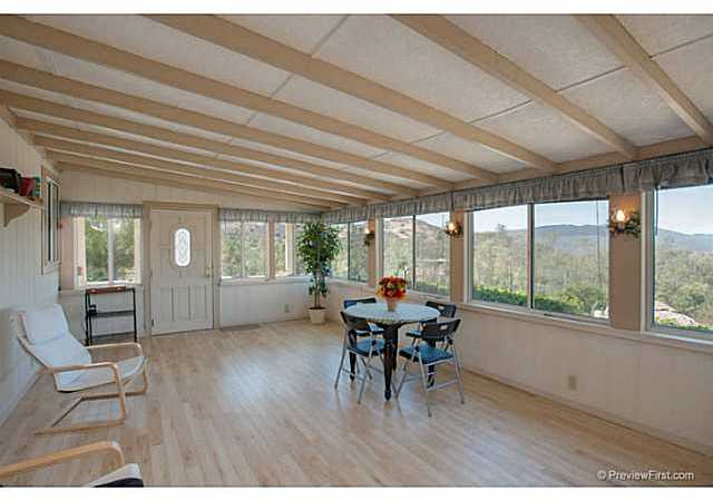 2204 Lookout Mountain Road Fallbrook, CA 92028 - Photo 5 of 25 You enter the main home through the large California room which has laminate flooring & multiple windows.