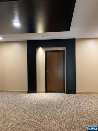a view of a livingroom with a wooden wall