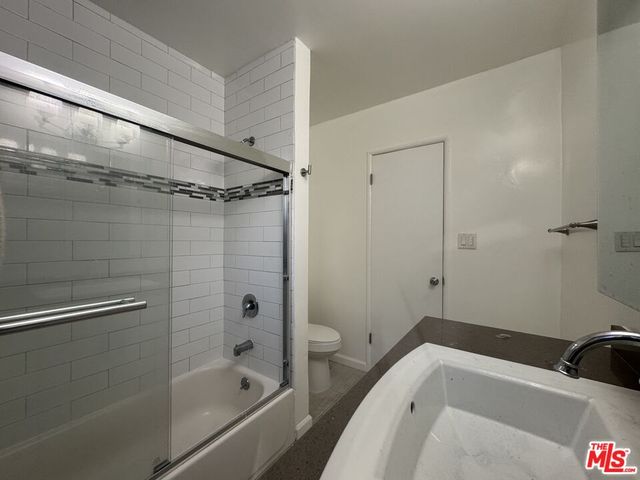 a view of a house with a bench in porch