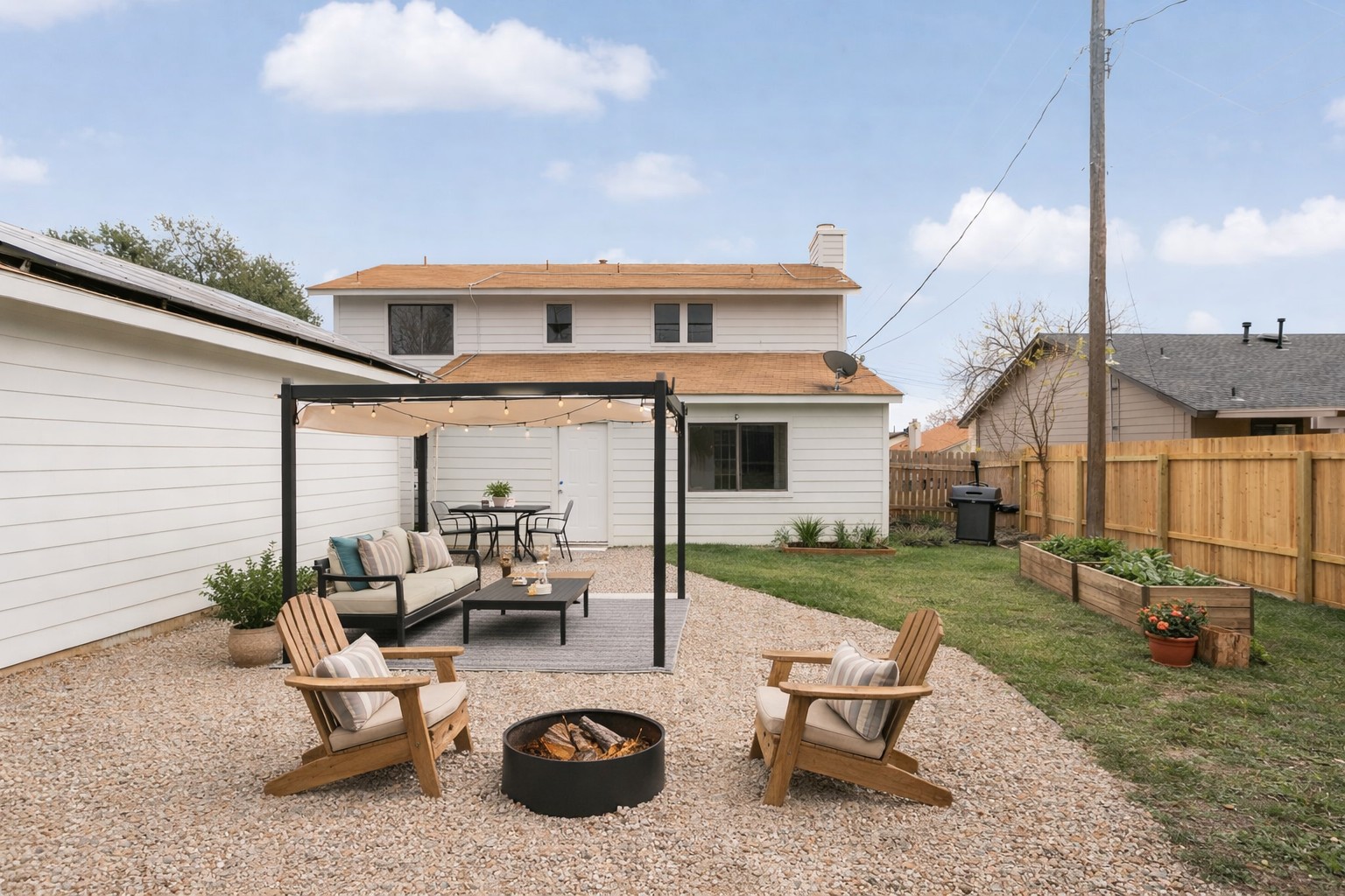 a view of a patio with table and chairs potted plants with wooden floor