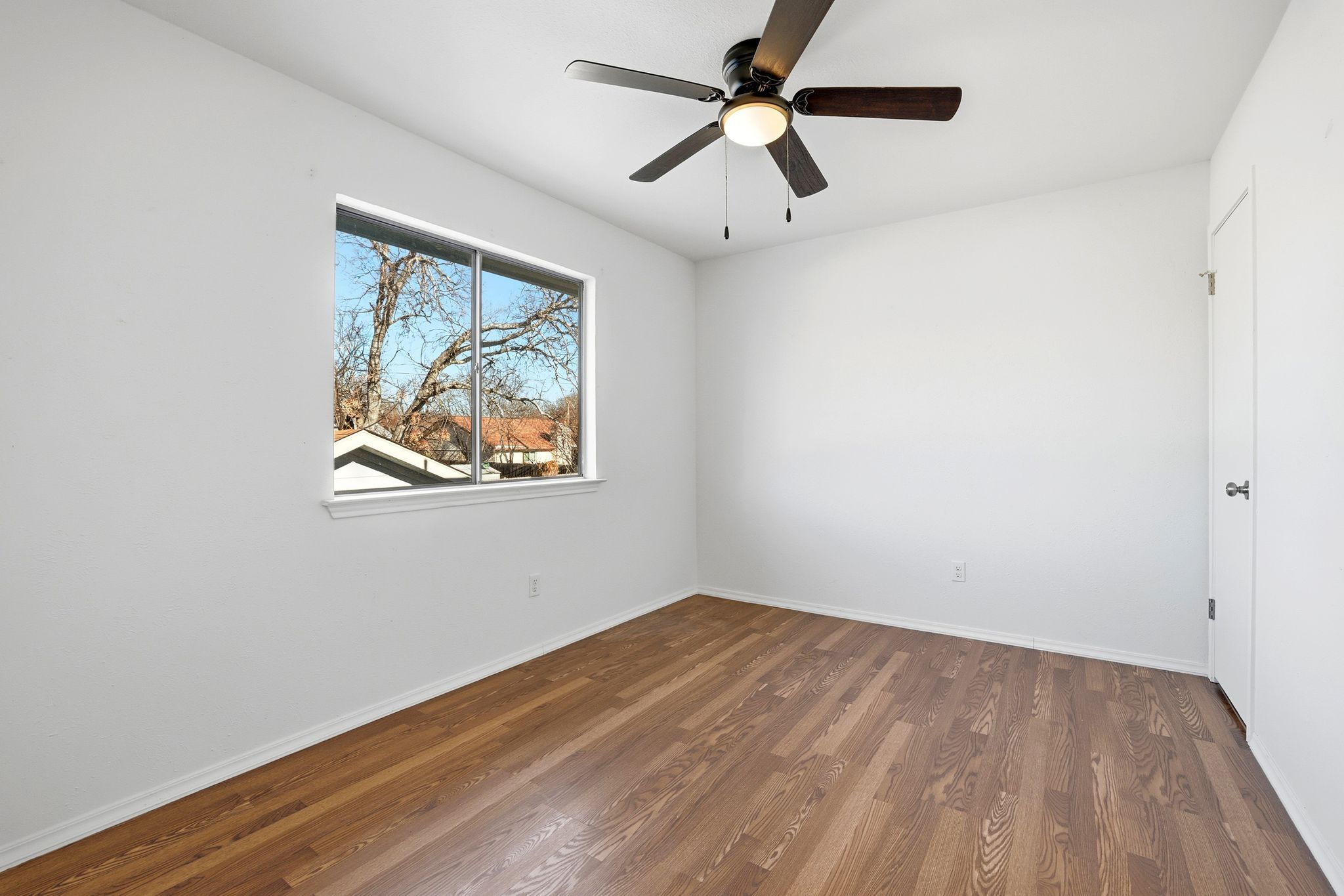 13004 Esplanade Street Austin, TX 78727 - Photo 15 of 36 Third bedroom (upstairs) with wood flooring, ceiling fan, and walk-in closet.