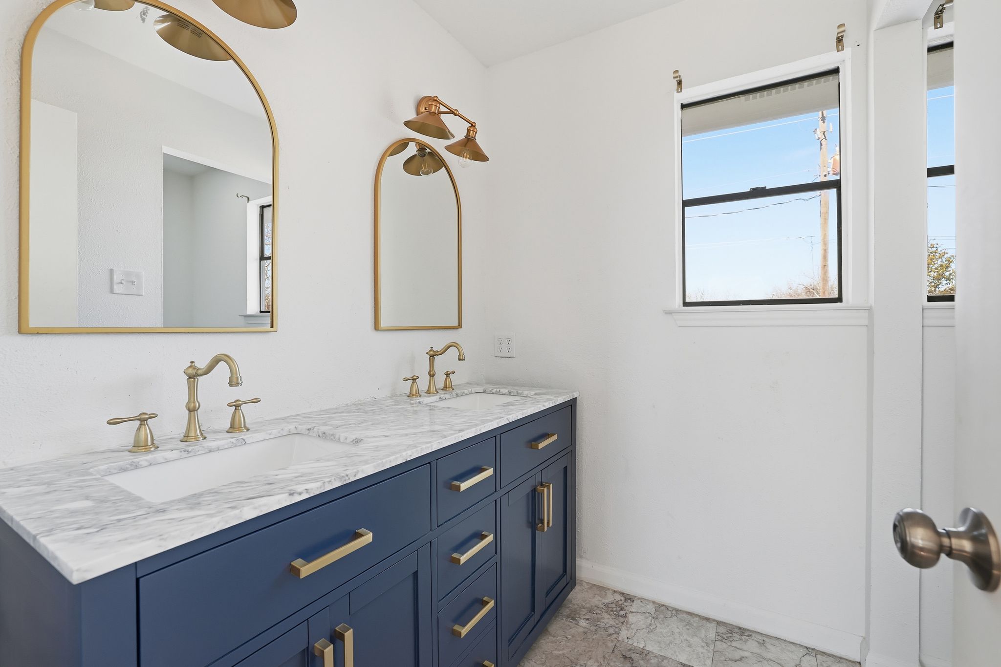 13004 Esplanade Street Austin, TX 78727 - Photo 25 of 38 a bathroom with a granite countertop sink and a mirror