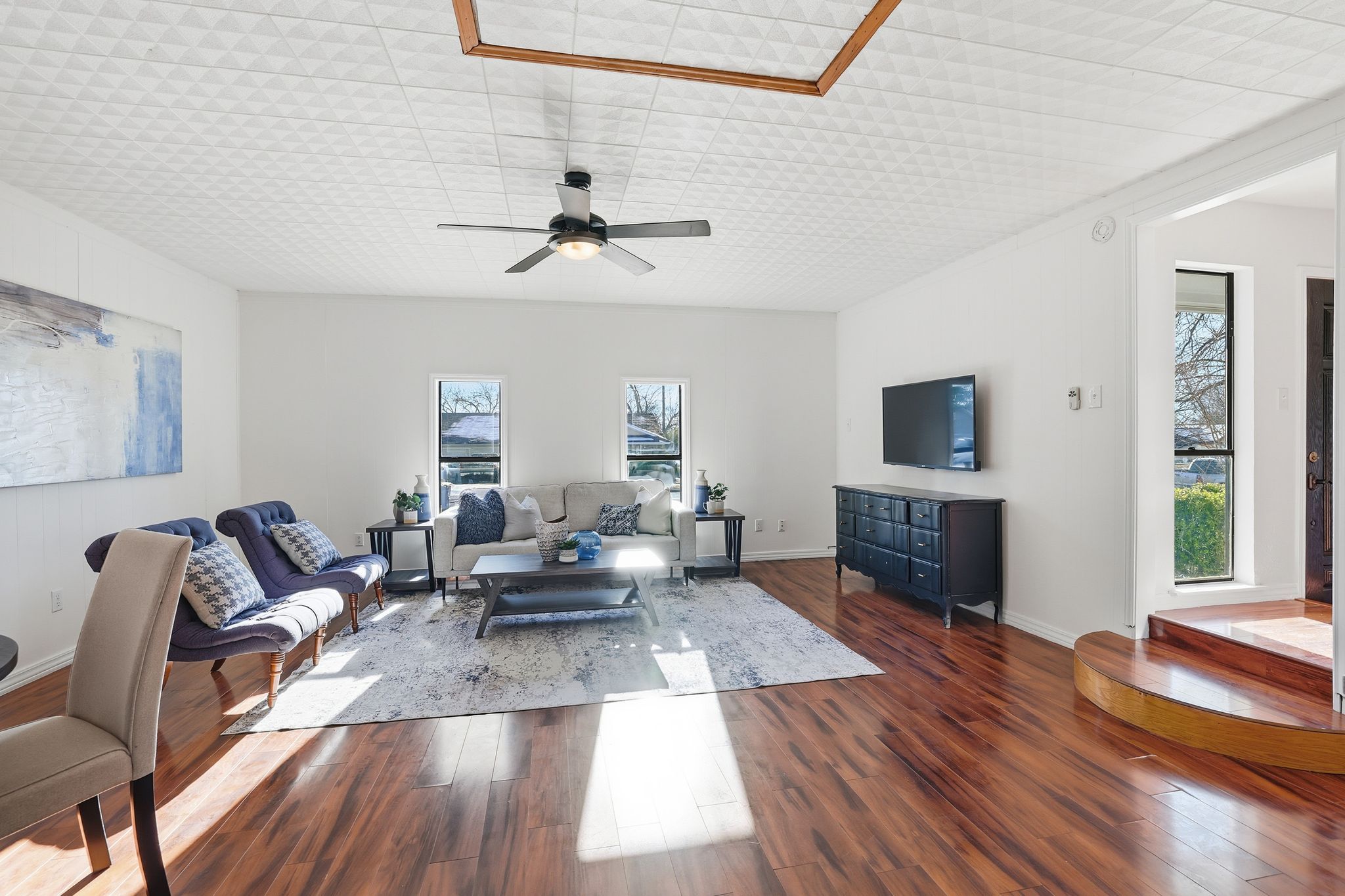 13004 Esplanade Street Austin, TX 78727 - Photo 28 of 36 Second living room/game room with dark wood-style flooring, plenty of natural light, and a ceiling fan