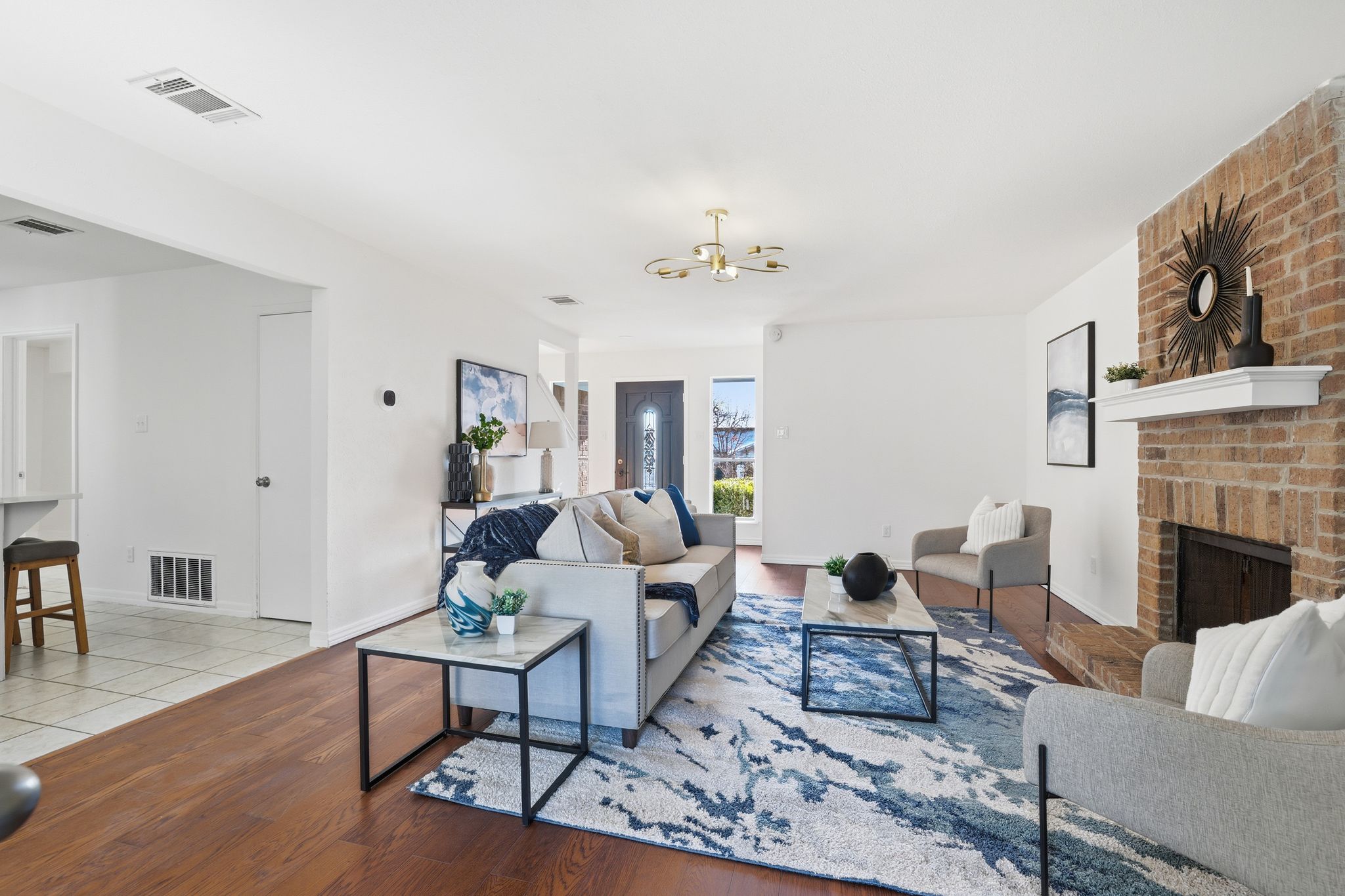 13004 Esplanade Street Austin, TX 78727 - Photo 3 of 38 a living room with furniture a fireplace and a table