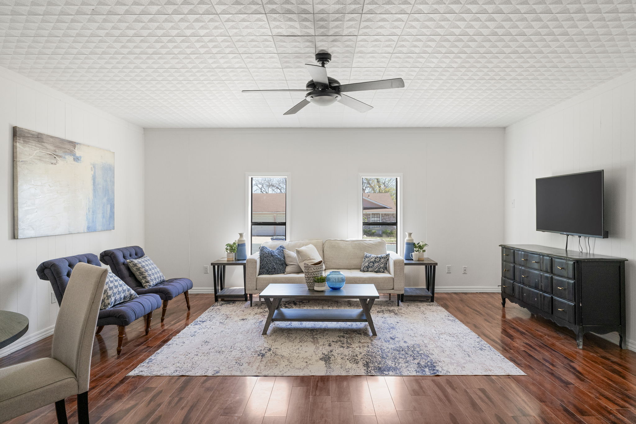 13004 Esplanade Street Austin, TX 78727 - Photo 6 of 36 Second living room/game room featuring dark wood-style floors and a ceiling fan