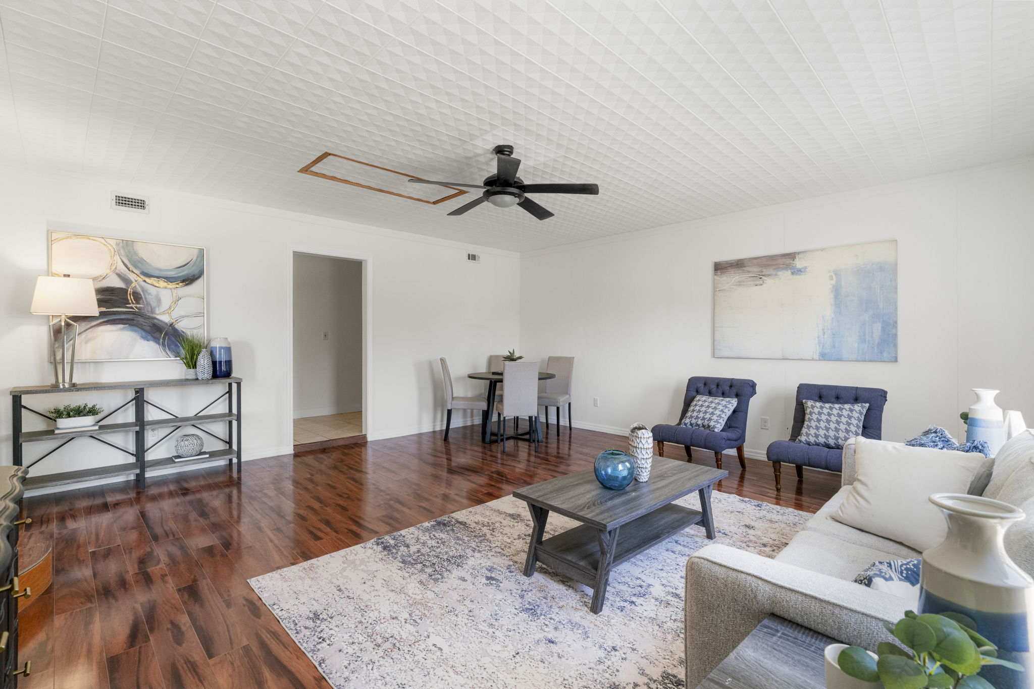 13004 Esplanade Street Austin, TX 78727 - Photo 7 of 36 Second living room/game room featuring a ceiling fan and dark wood-style flooring