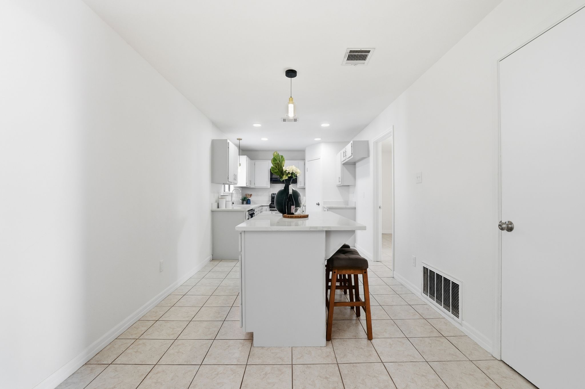 13004 Esplanade Street Austin, TX 78727 - Photo 9 of 38 a kitchen with a sink cabinets and window