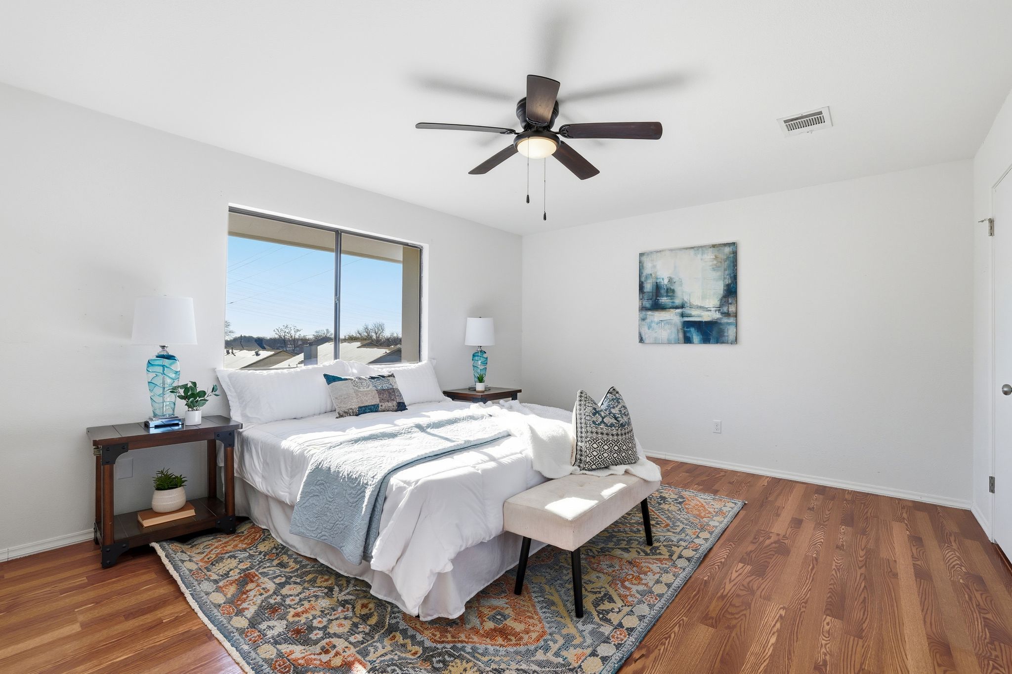 13004 Esplanade Street Austin, TX 78727 - Photo 10 of 36 Primary bedroom with wood finished floors and ceiling fan
