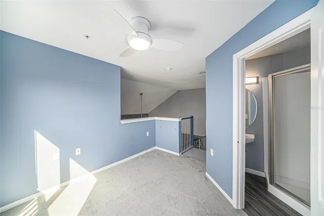 a view of a hallway with a bathroom