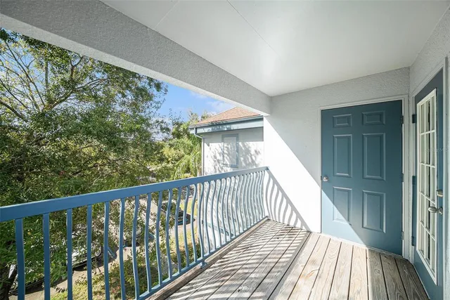 a view of balcony with wooden floor