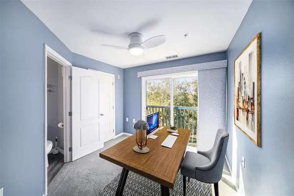 a view of a dining room with furniture window and outside view