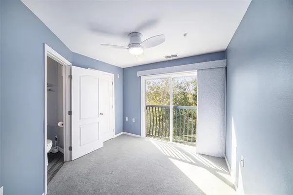 a view of a room with large windows