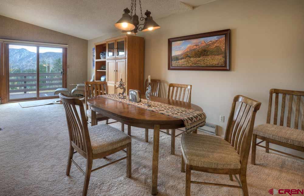 322 Sheol Street, Unit 7 Durango, CO 81301 - Photo 11 of 35 a view of a dining room with furniture window and outside view