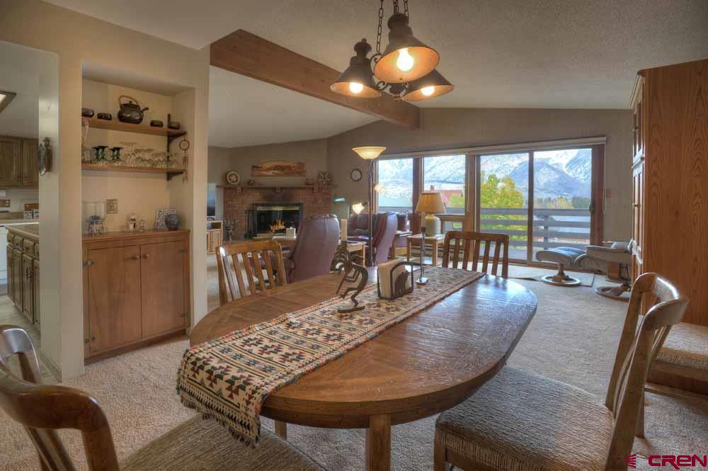 322 Sheol Street, Unit 7 Durango, CO 81301 - Photo 12 of 35 a view of a dining room with furniture window and outside view