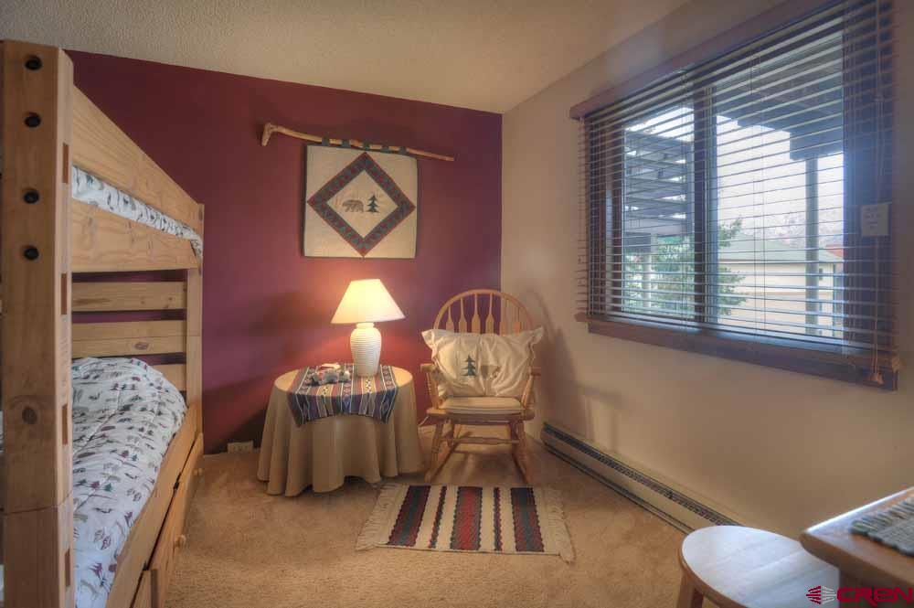 322 Sheol Street, Unit 7 Durango, CO 81301 - Photo 27 of 35 a living room with furniture and a window