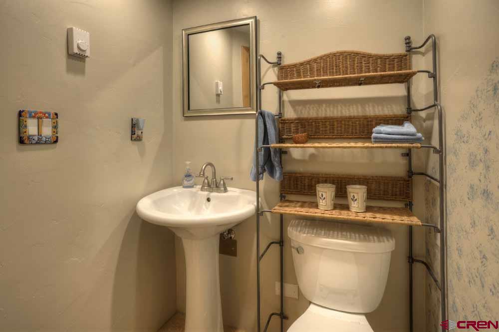 322 Sheol Street, Unit 7 Durango, CO 81301 - Photo 28 of 35 a bathroom with a toilet sink and mirror