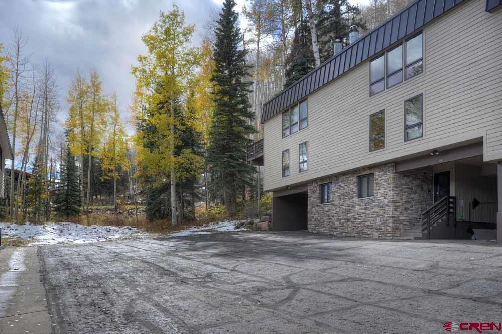 322 Sheol Street, Unit 7 Durango, CO 81301 - Photo 32 of 35 a view of a house with a yard