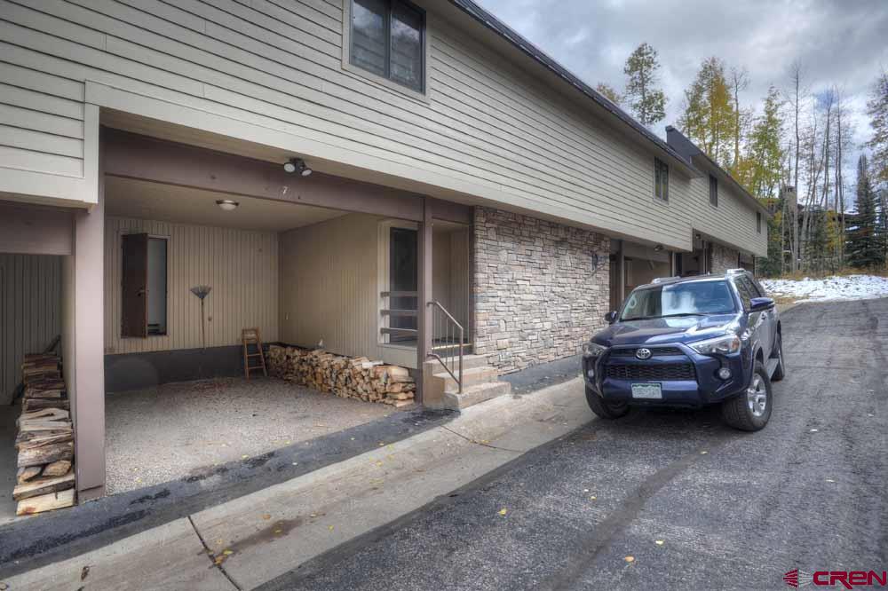 322 Sheol Street, Unit 7 Durango, CO 81301 - Photo 34 of 35 a car parked in front of a house