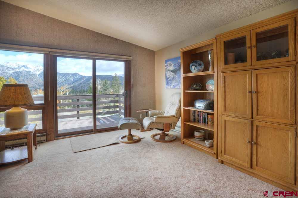 322 Sheol Street, Unit 7 Durango, CO 81301 - Photo 9 of 35 a living room with furniture a rug and a window