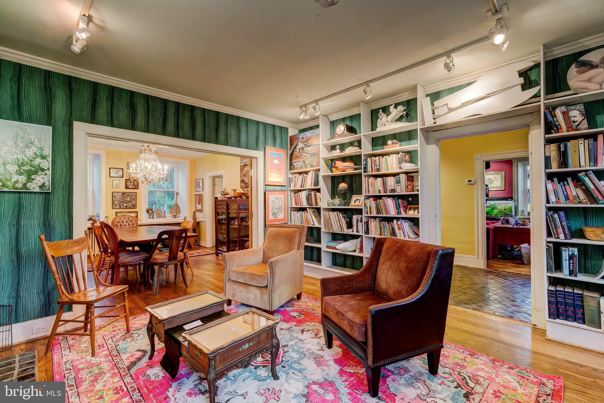 1449 Corbett Road Monkton, MD 21111 - Photo 13 of 34 a living room with furniture a rug and a book shelf