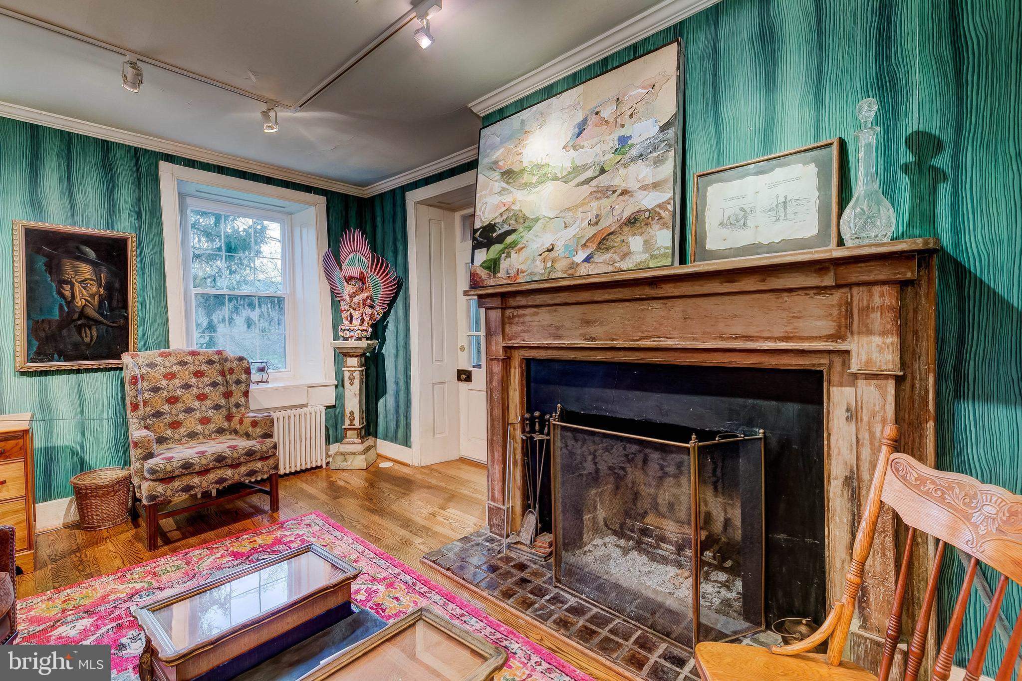 1449 Corbett Road Monkton, MD 21111 - Photo 25 of 34 a living room with furniture a flat screen tv and a fireplace