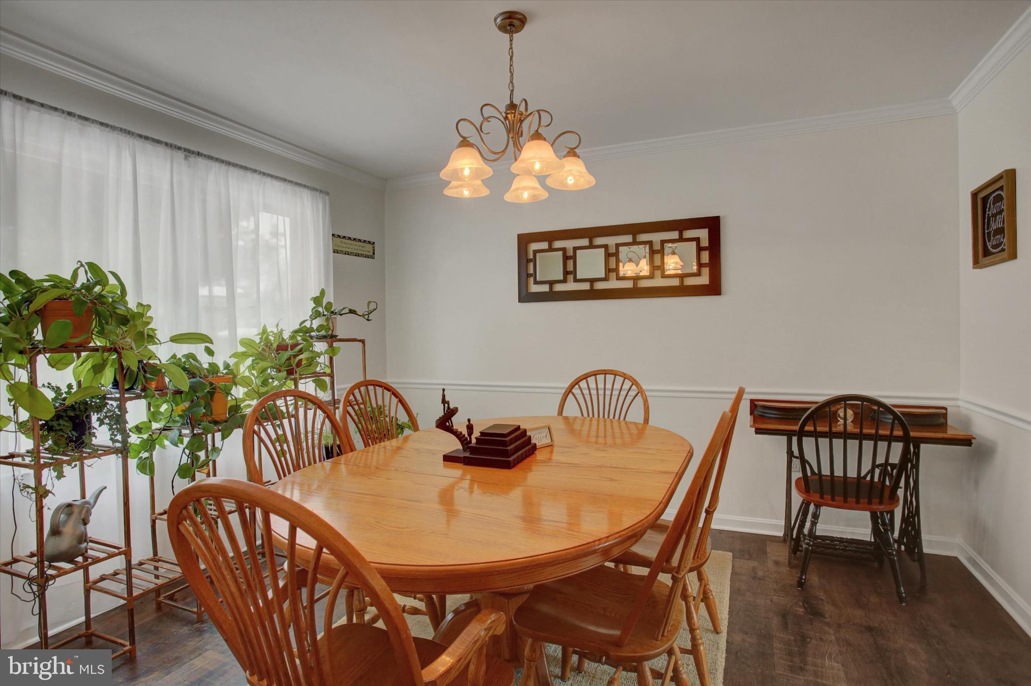 65 Ridgeview Drive Etters, PA 17319 - Photo 11 of 50 a dining room with furniture potted plants and wooden floor