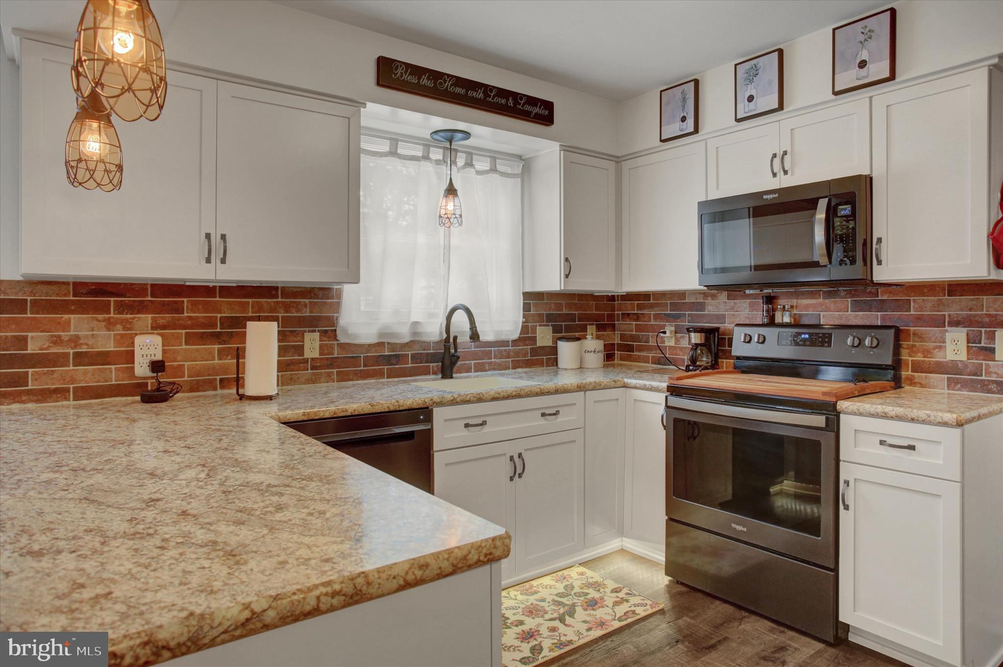 65 Ridgeview Drive Etters, PA 17319 - Photo 15 of 50 a kitchen with stainless steel appliances granite countertop a stove a sink and a microwave