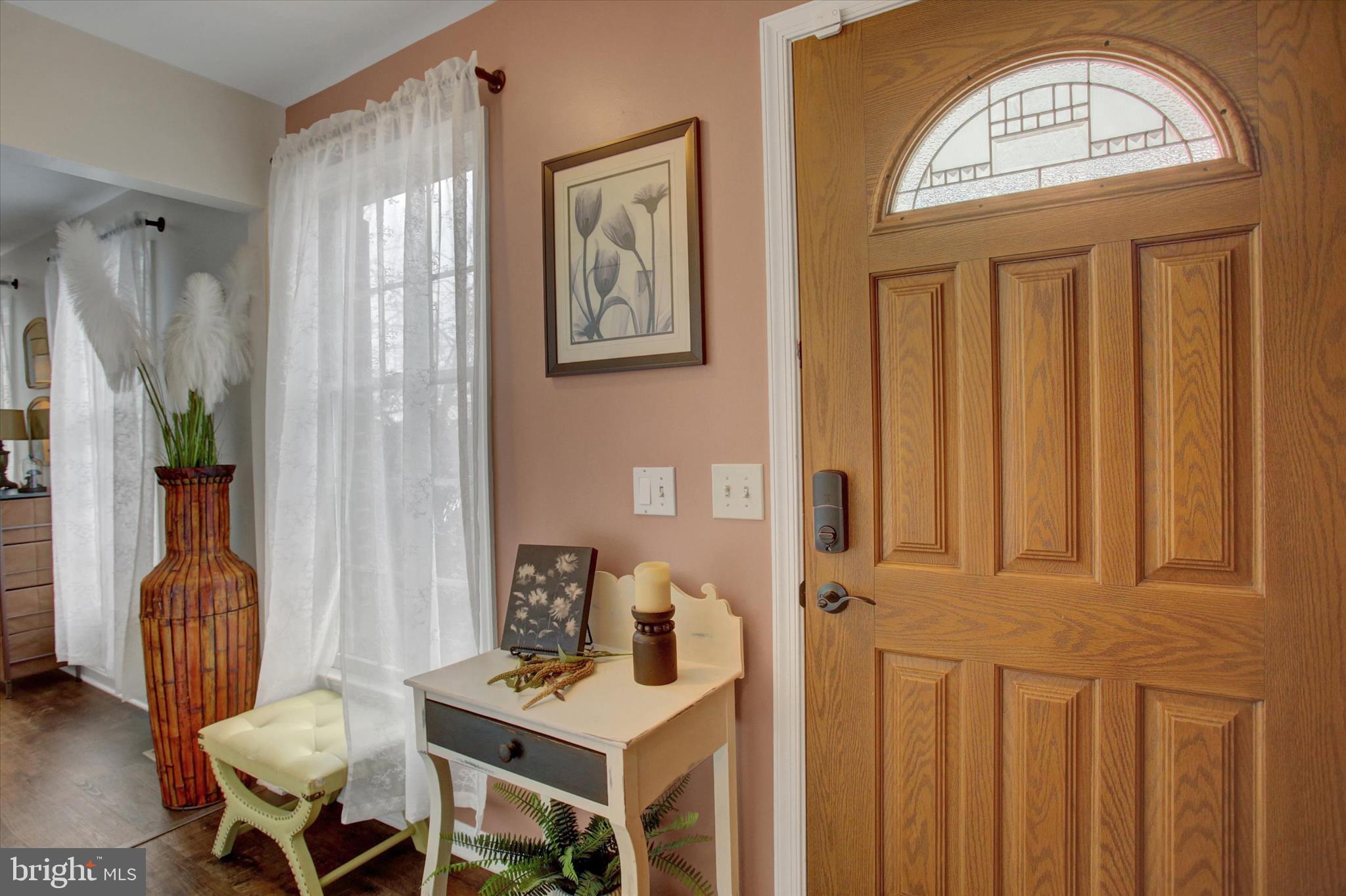 65 Ridgeview Drive Etters, PA 17319 - Photo 6 of 50 a view of a hallway with furniture and wooden floor