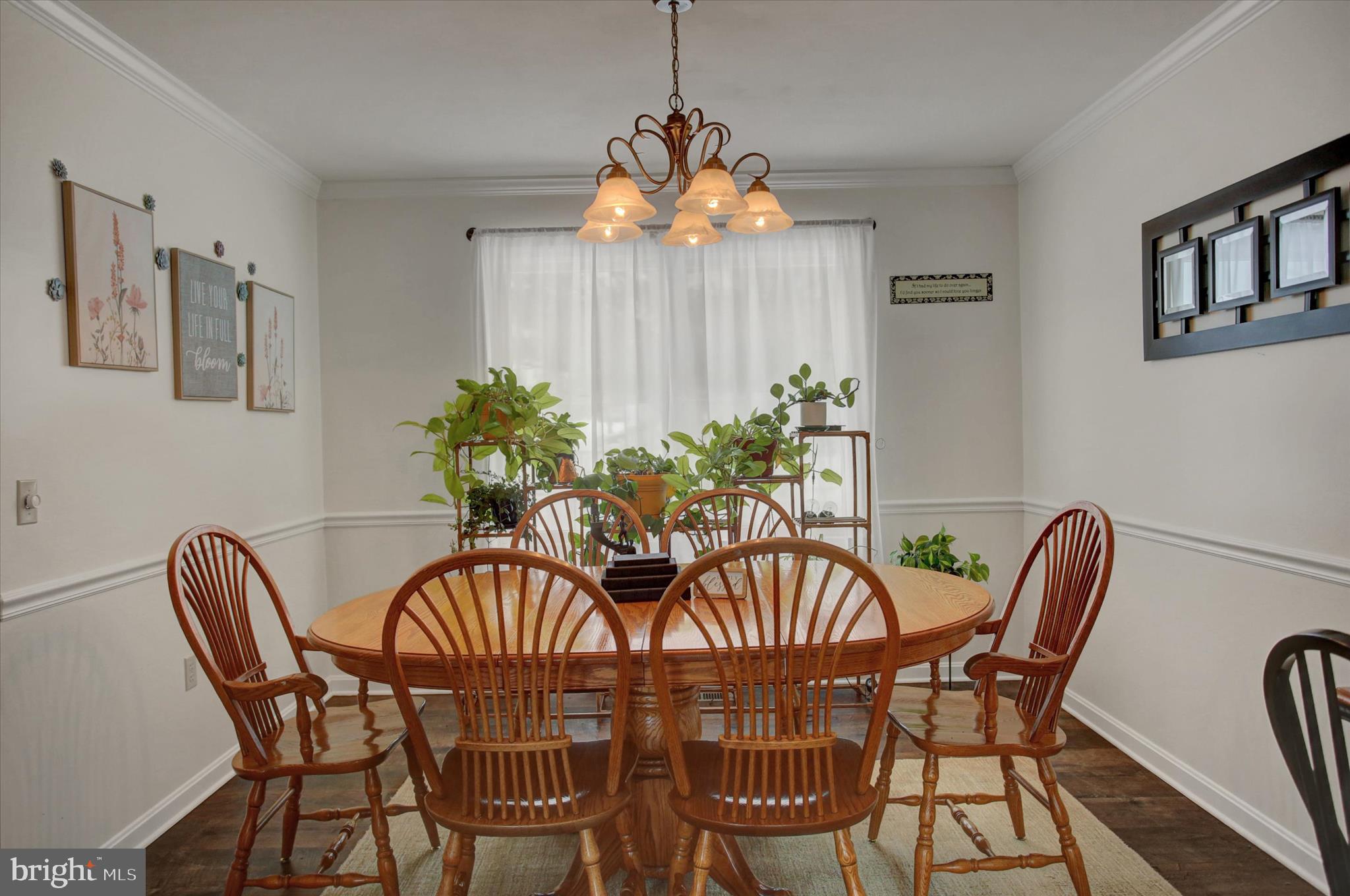 65 Ridgeview Drive Etters, PA 17319 - Photo 10 of 50 a dining room with furniture potted plants and wooden floor