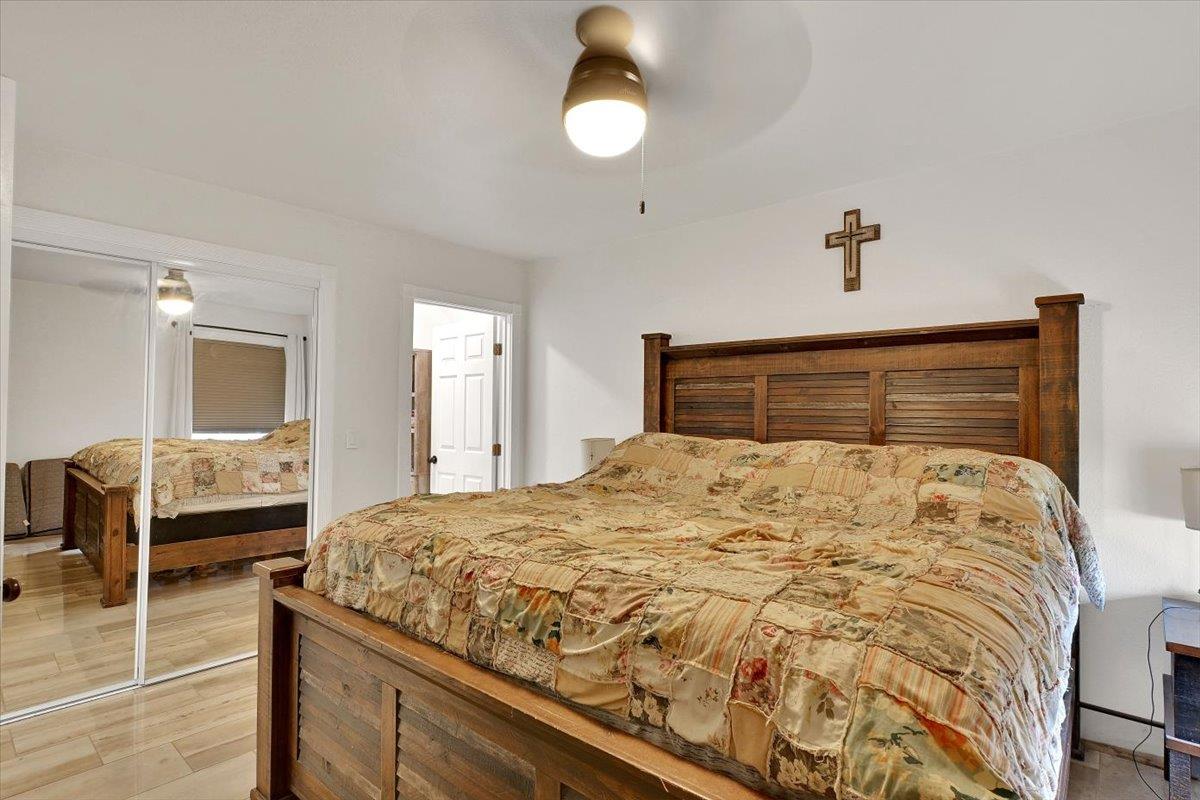 203 Tennessee Lane Bangor, CA 95901 - Photo 17 of 54 a bedroom with a bed and wooden floor