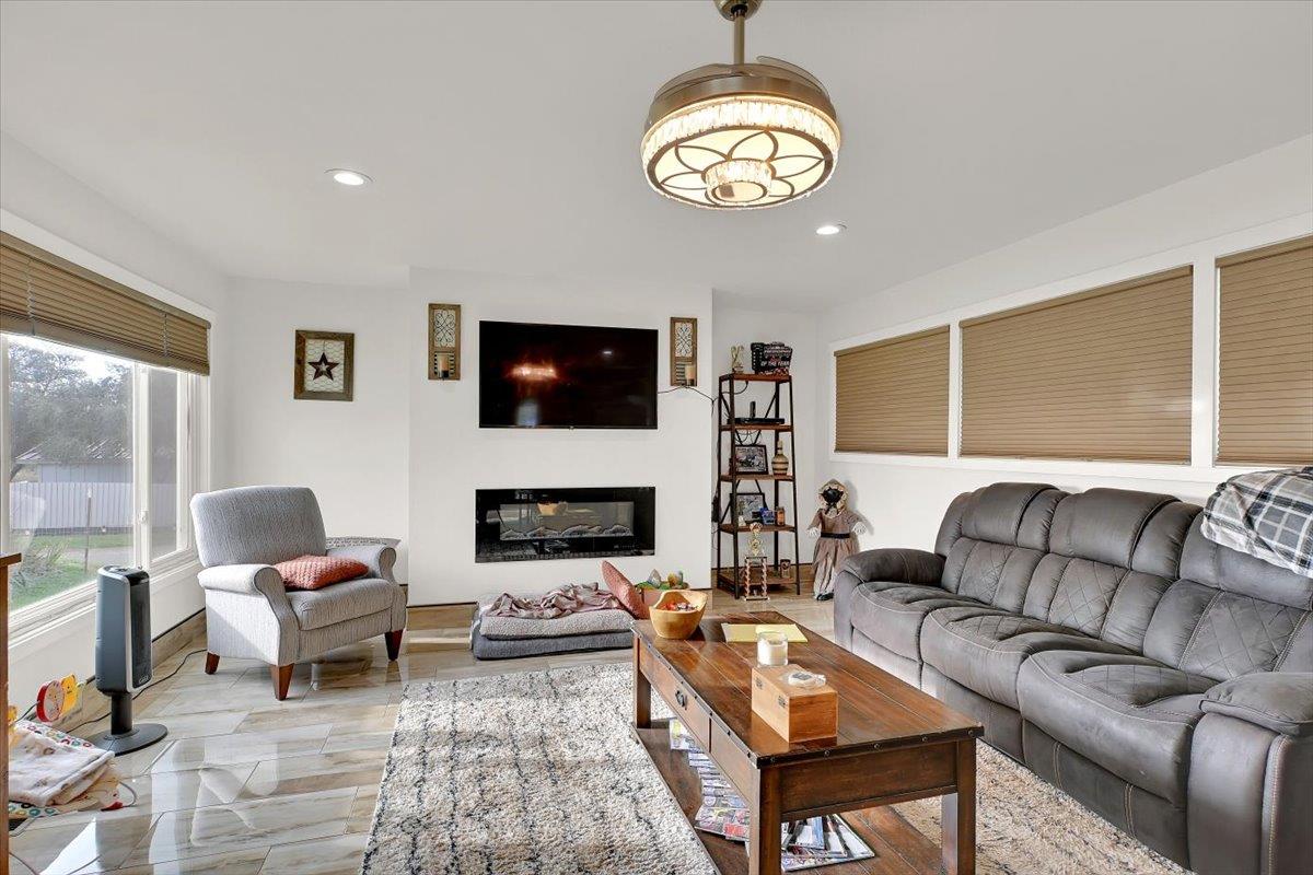 203 Tennessee Lane Bangor, CA 95901 - Photo 4 of 54 a living room with furniture chandelier and a flat screen tv
