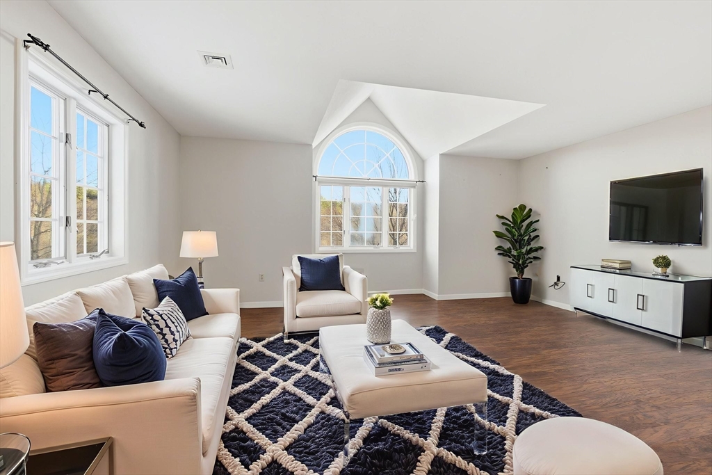 18 Palmer Road, Unit 6 Monson, MA 01057 - Photo 12 of 42 a living room with furniture a flat screen tv and a large window