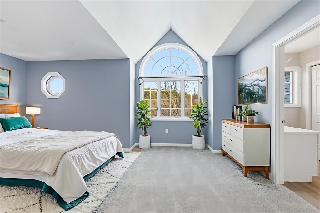 18 Palmer Road, Unit 6 Monson, MA 01057 - Photo 23 of 42 a bedroom with a bed and a large window