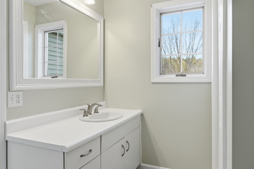 18 Palmer Road, Unit 6 Monson, MA 01057 - Photo 27 of 42 a bathroom with a sink and a vanity