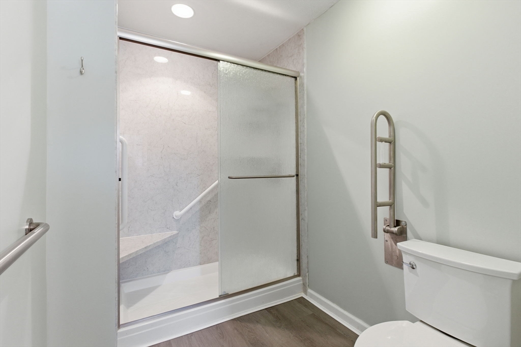 18 Palmer Road, Unit 6 Monson, MA 01057 - Photo 28 of 42 a bathroom with a glass shower door