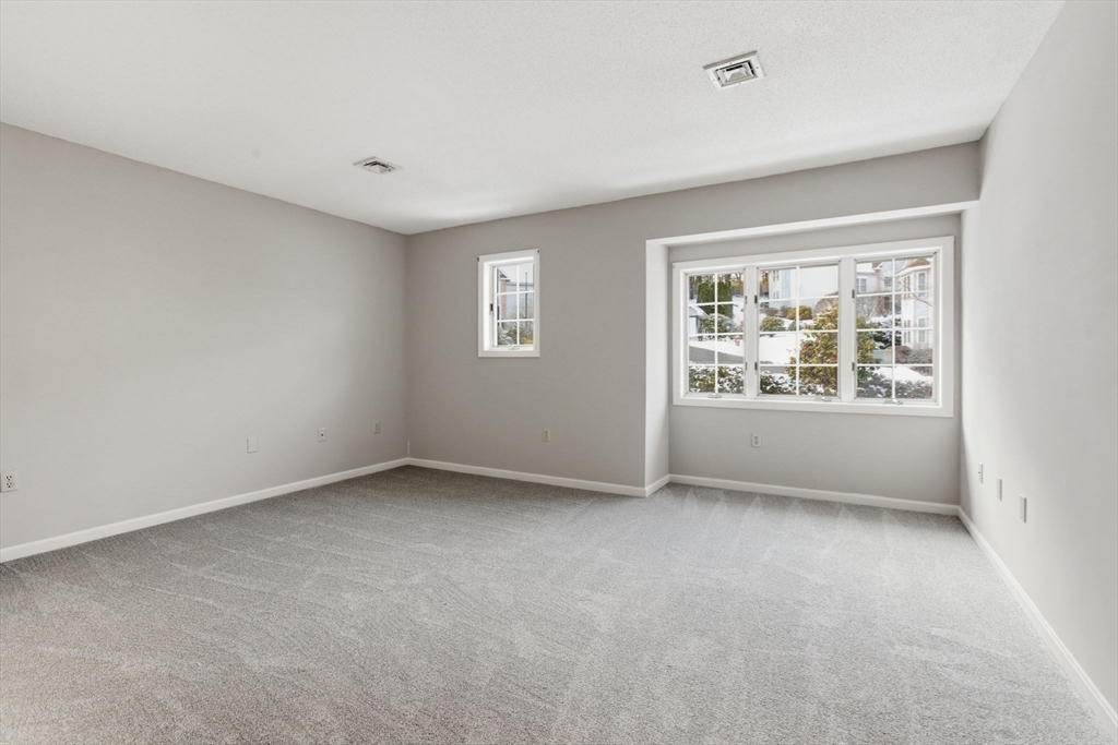 18 Palmer Road, Unit 6 Monson, MA 01057 - Photo 29 of 42 an empty room with windows