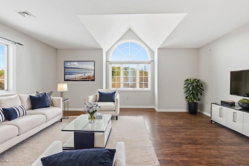 18 Palmer Road, Unit 6 Monson, MA 01057 - Photo 6 of 42 a living room with furniture and a flat screen tv