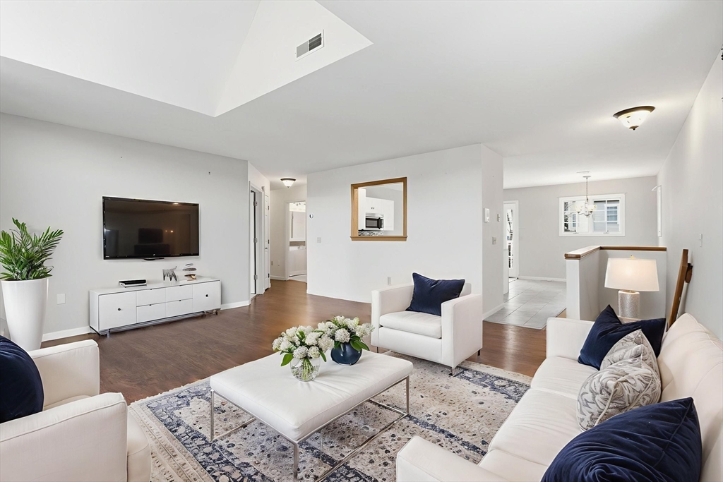 18 Palmer Road, Unit 6 Monson, MA 01057 - Photo 10 of 42 a living room with furniture and a flat screen tv