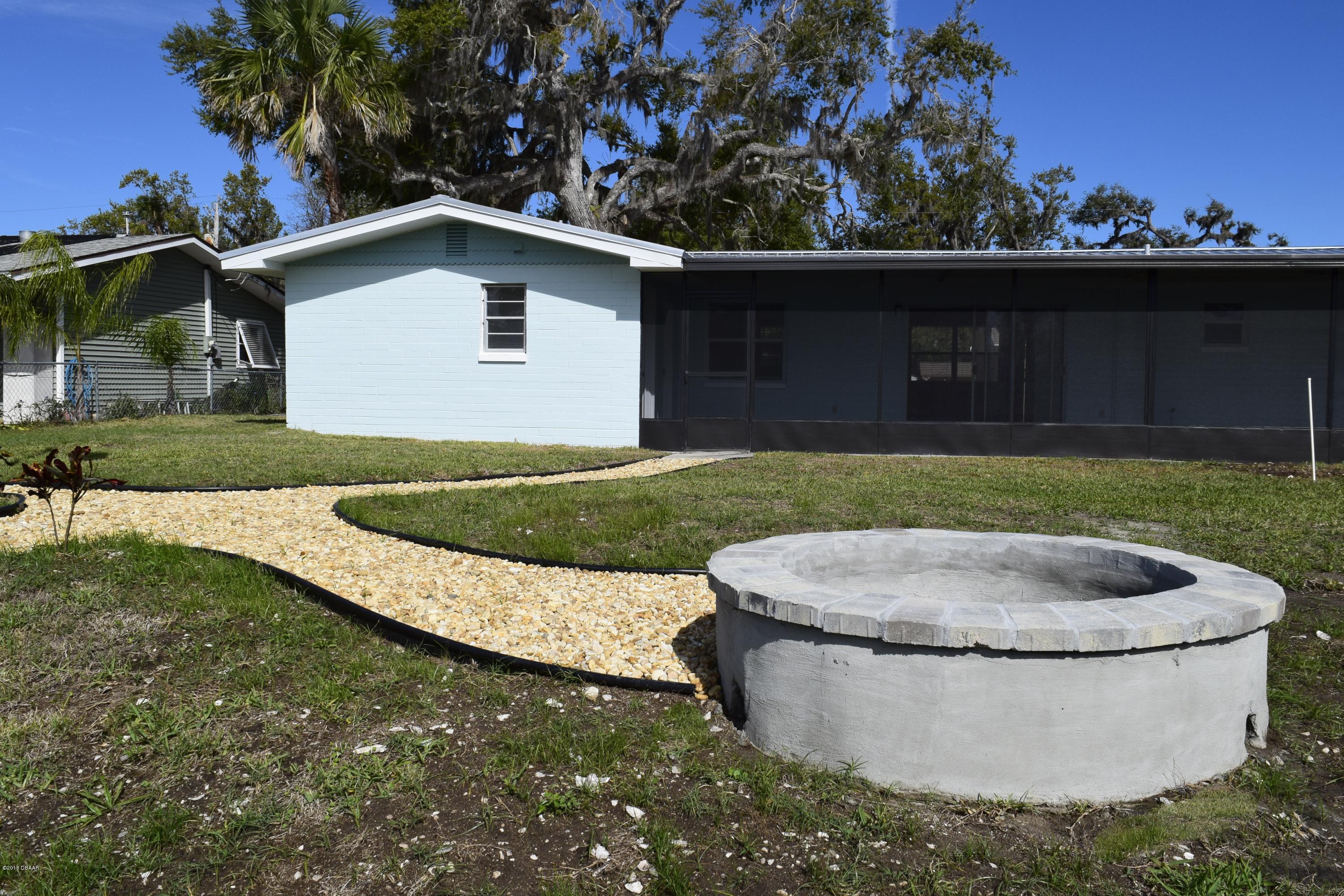 168 Azalea Road Edgewater, FL 32141 - Photo 18 of 28 fire pit