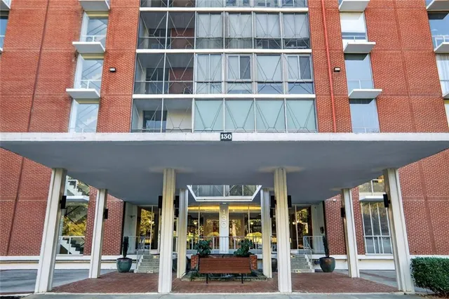 a front view of a building with a porch