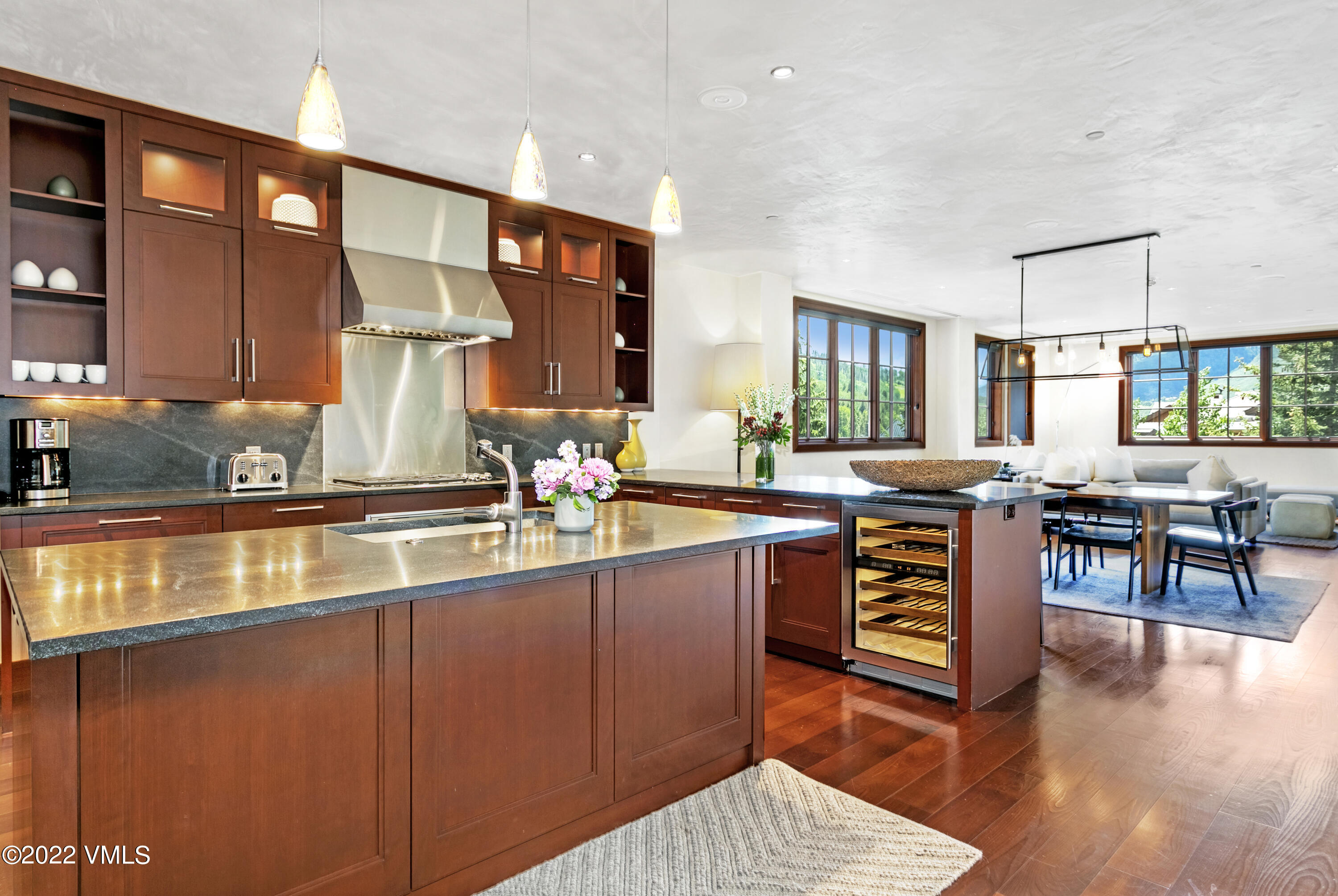 a kitchen with stainless steel appliances granite countertop a sink and a counter space