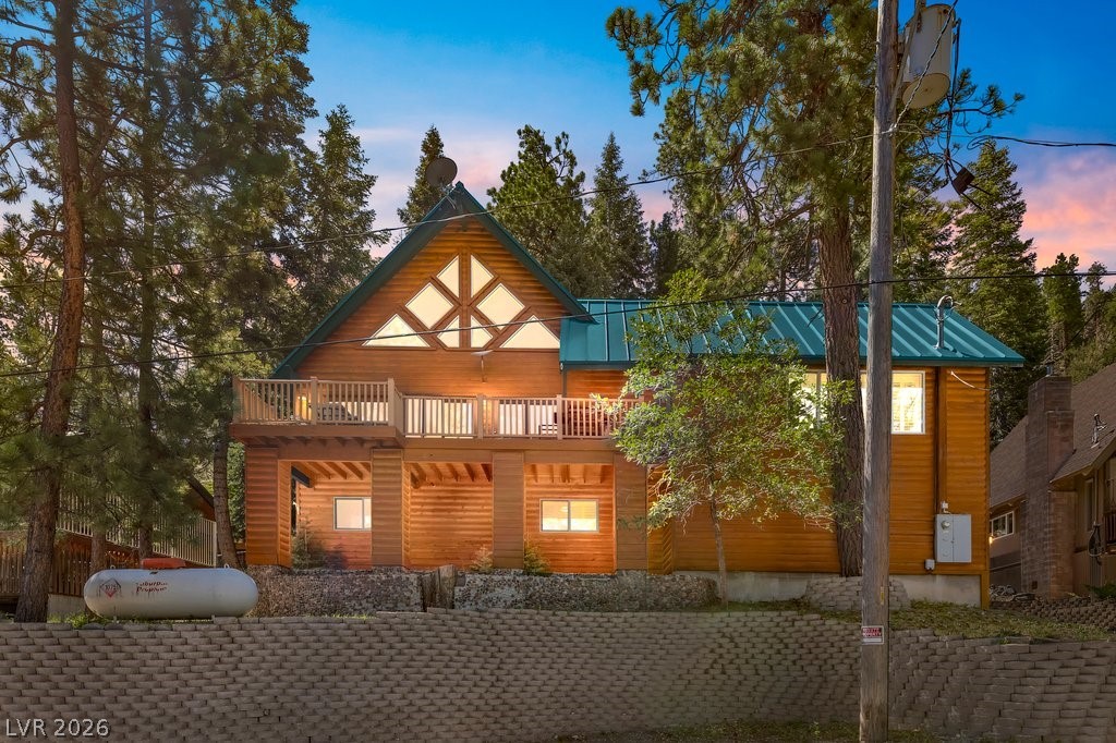 370 Alpine Way Mount Charleston, NV 89124 - Photo 1 of 79 Sited against U.S. Forest land at the edge of Rainbow Subdivision, this mountain home blends timeless charm with refined comfort.