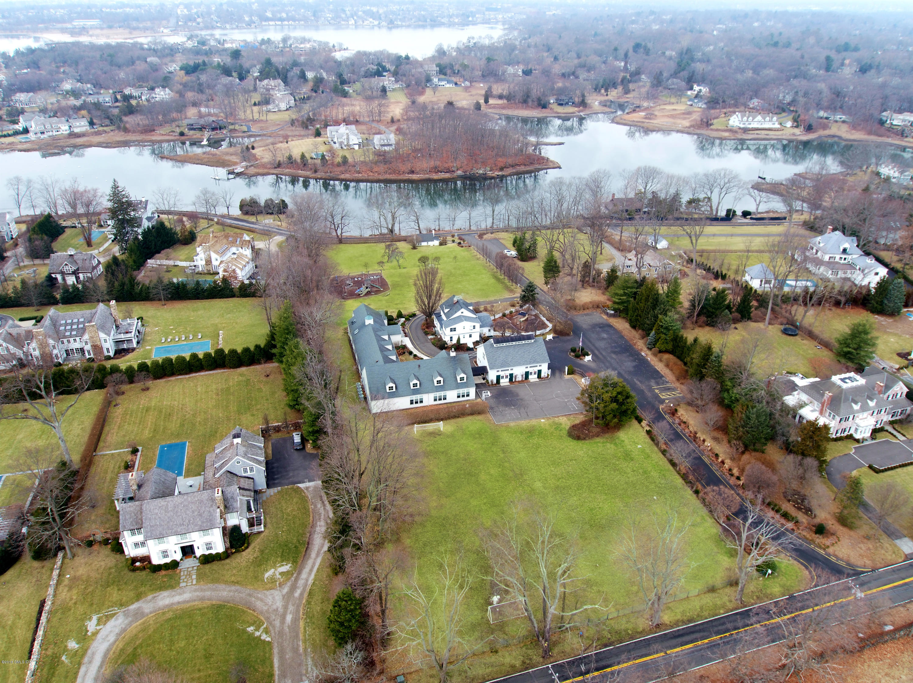 an aerial view of a house with a lake view