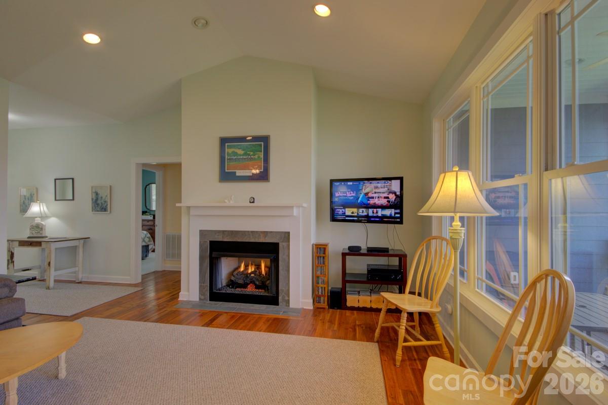751 Everett Road Pisgah Forest, NC 28768 - Photo 21 of 36 a living room with furniture fireplace and wall painting