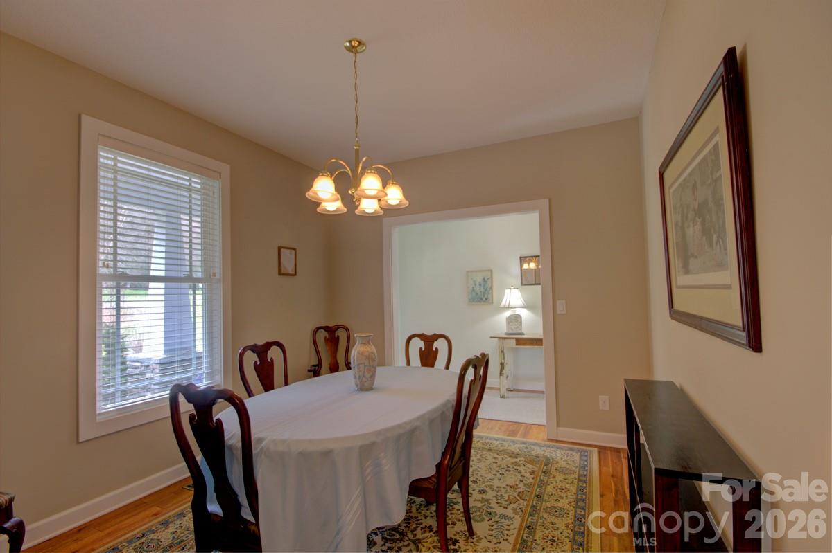 751 Everett Road Pisgah Forest, NC 28768 - Photo 5 of 36 a view of a dining room with furniture and chandelier