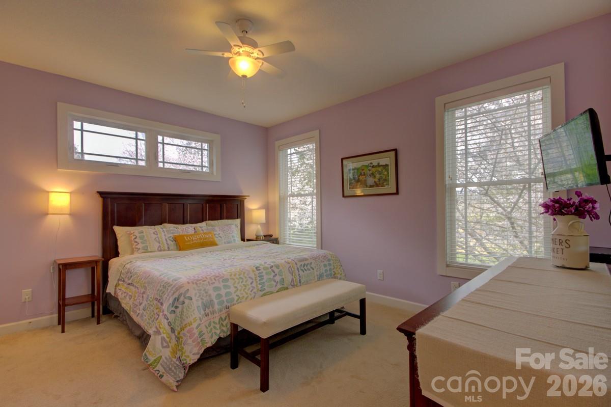 751 Everett Road Pisgah Forest, NC 28768 - Photo 7 of 36 a bedroom with a bed and a window
