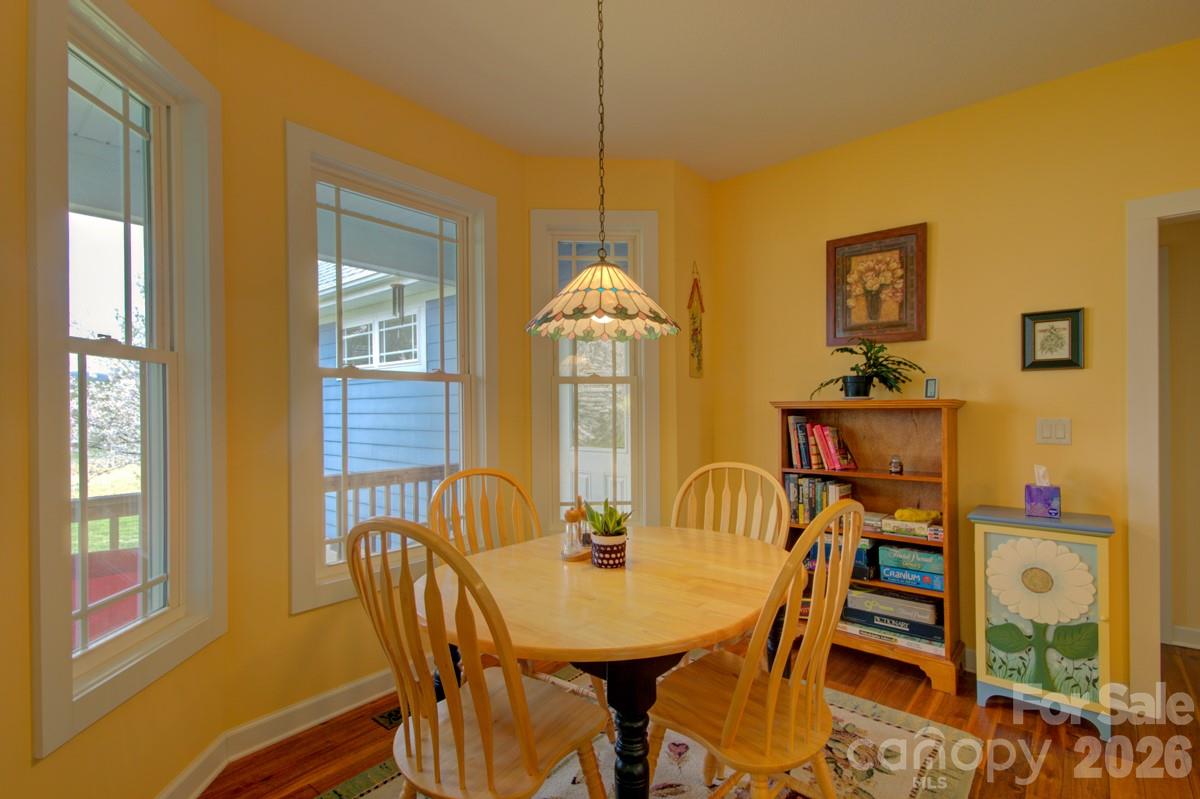 751 Everett Road Pisgah Forest, NC 28768 - Photo 10 of 36 a view of a dining room with furniture window and outside view