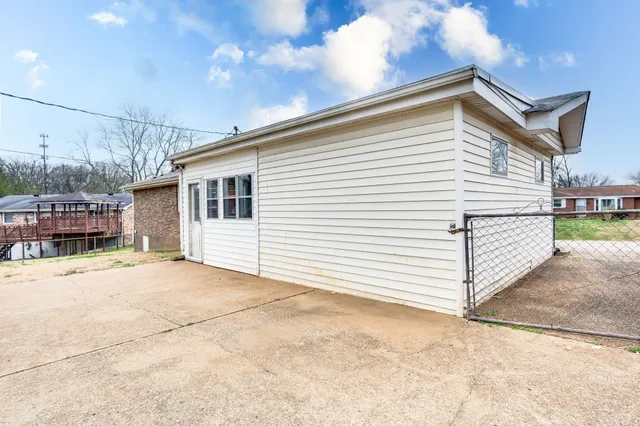 a view of a backyard of a house
