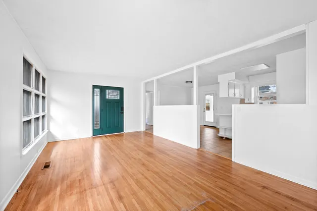 a view of a livingroom with furniture and wooden floor