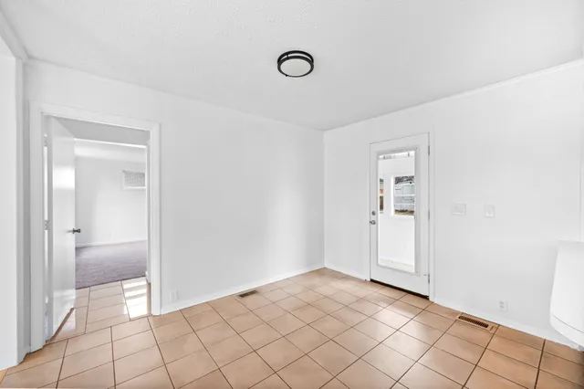 a kitchen with a sink and a refrigerator